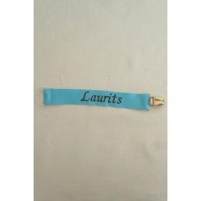 Turkis sutteholder med navn.