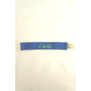 Coboltbl sutteholder med navn.